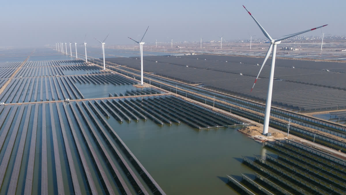 Energy Fallout From Iran War Signals A Global Wake-up Call For Renewable Energy FILE - Wind turbines operate along a solar farm near Weifang in eastern China's Shandong province on March 22, 2024.