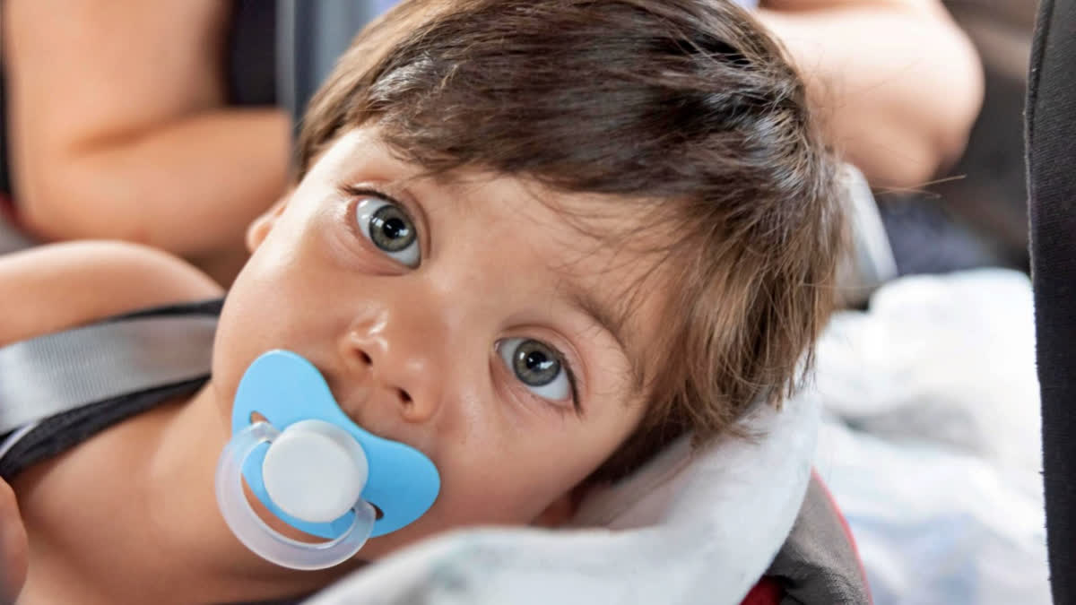 Boy using a pacifier