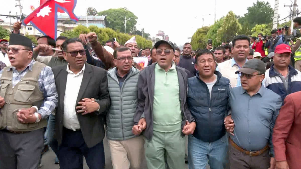 Opposition Nepali Congress Urges Govt To Revoke Customs Duty On Importing Goods From India FILE- Communist Party of Nepal (Unified Marxist–Leninist) supporters protest demanding the release of former Prime Minister KP Sharma Oli, in Kathmandu.