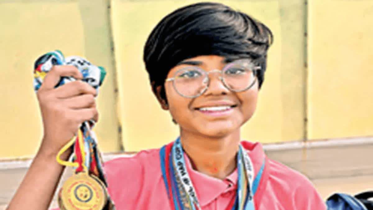 Divya with the medals she won.