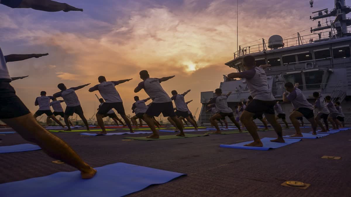 The Indian Navy personnel participate in a yoga session ahead of the International Day of Yoga