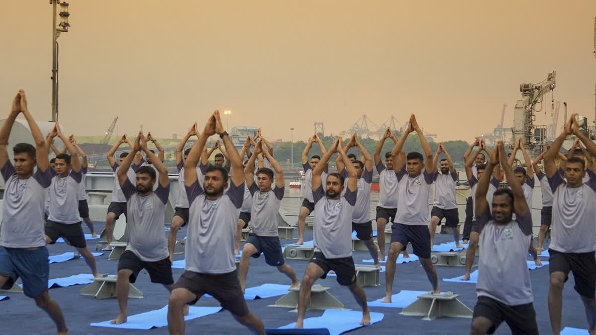 The Indian Navy personnel participate in a yoga session ahead of the International Day of Yoga