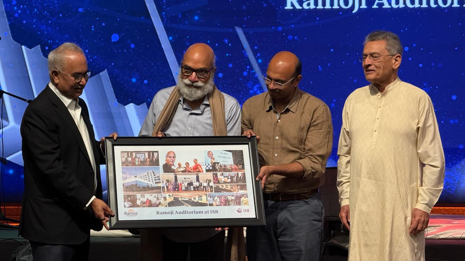 A memento being presented to Ch Kiron, Chairman and Managing Director of the Ramoji Group.