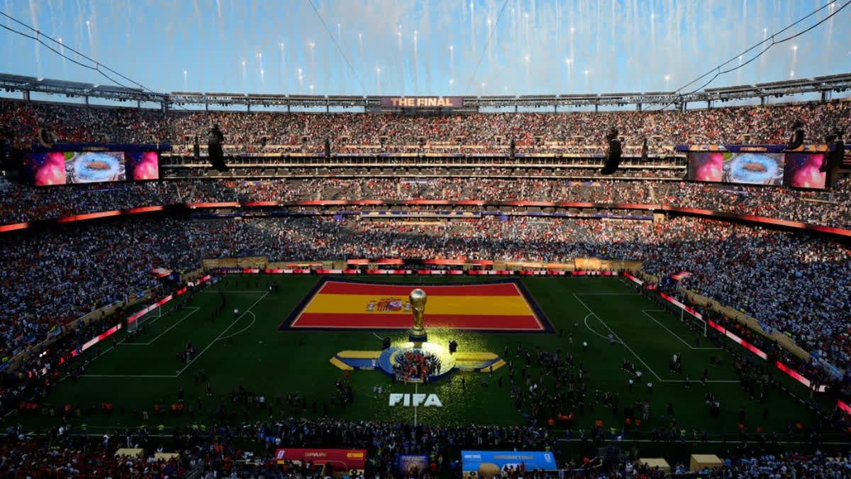 Spain celebrate with the trophy after the World Cup final soccer match against Argentina in East Rutherford.