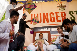 Climate activist Sonam Wangchuk being attended by medical professionals as CJP founder Abhijeet Dipke looks on during a protest at Jantar Mantar, in New Delhi, Wednesday, July 15, 2026.