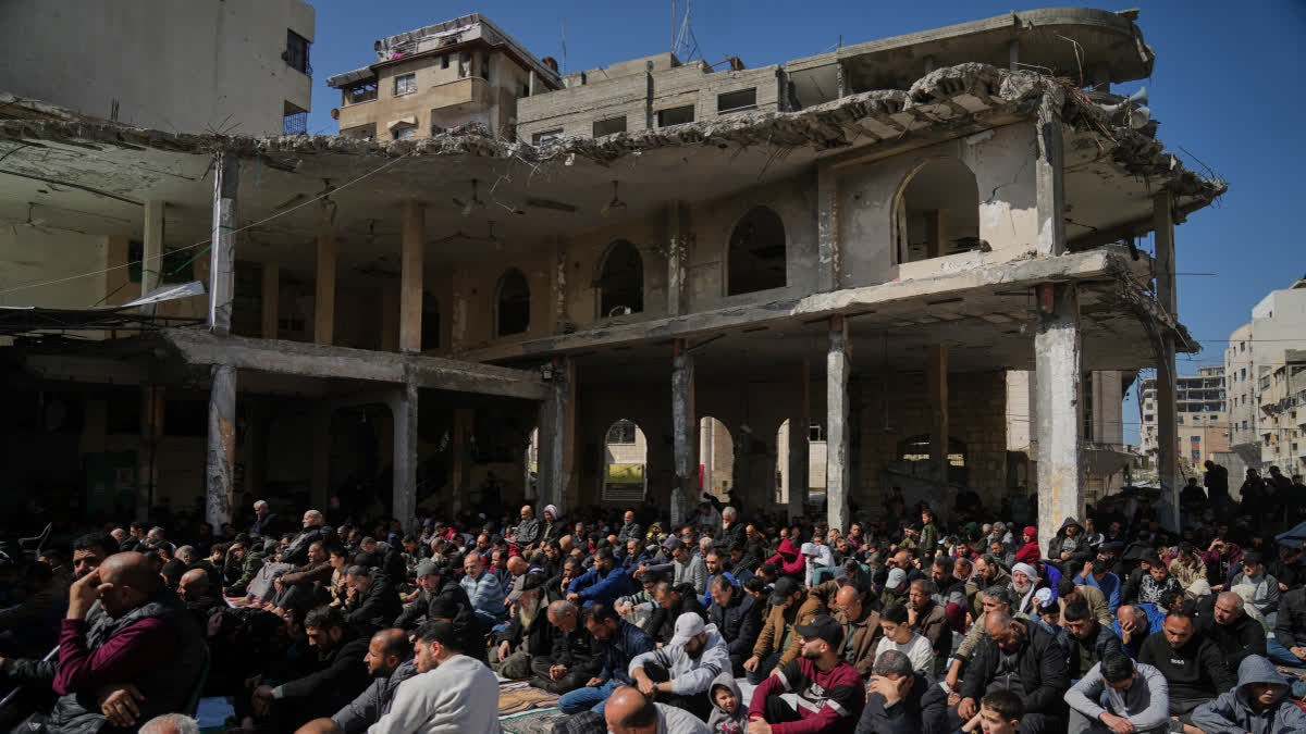 Muslim worshippers gather for Friday prayer during the holy fasting month of Ramadan at the Alkanz Mosque, which was damaged during the Israel–Hamas war, in Gaza City, Friday, Feb. 20, 2026.