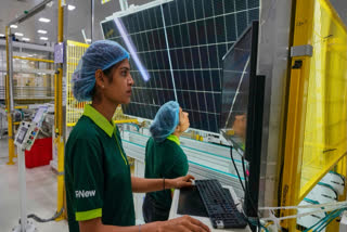 FILE - Workers check the quality of a solar panel at the production line up at a ReNew manufacturing plant on the outskirts of Jaipur, India, Aug. 21, 2025.