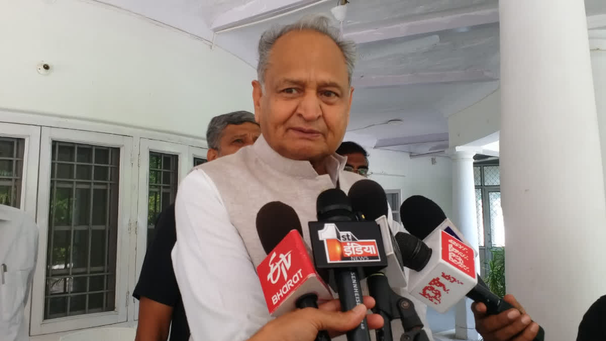 Gehlot speaking to the media.