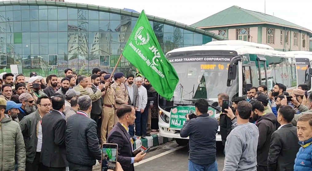 Officials flag off a batch of Hajj pilgrims in Srinagar