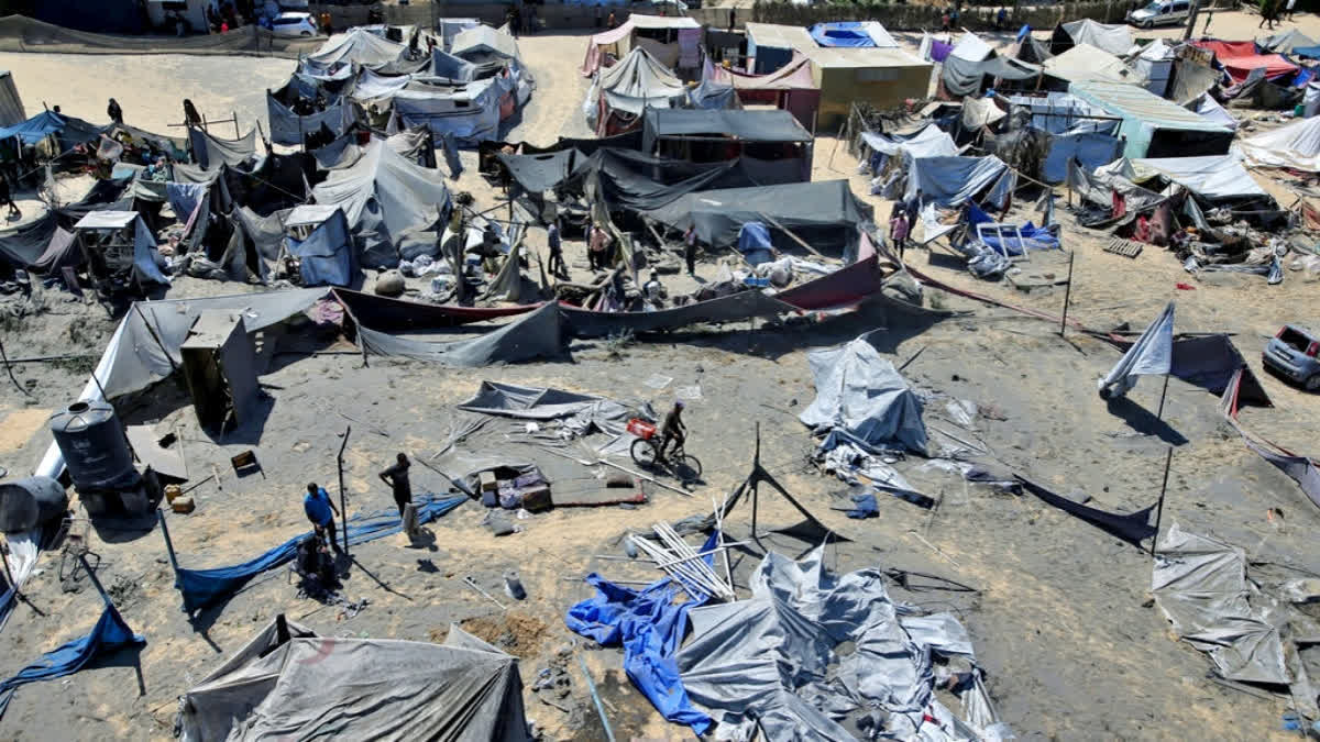 Israel Says Bodies Of 6 Hostages Retrieved From Gaza Tunnel Palestinians inspect the damage at a site hit by an Israeli bombardment on Khan Younis, southern Gaza Strip, Saturday, July 13, 2024.