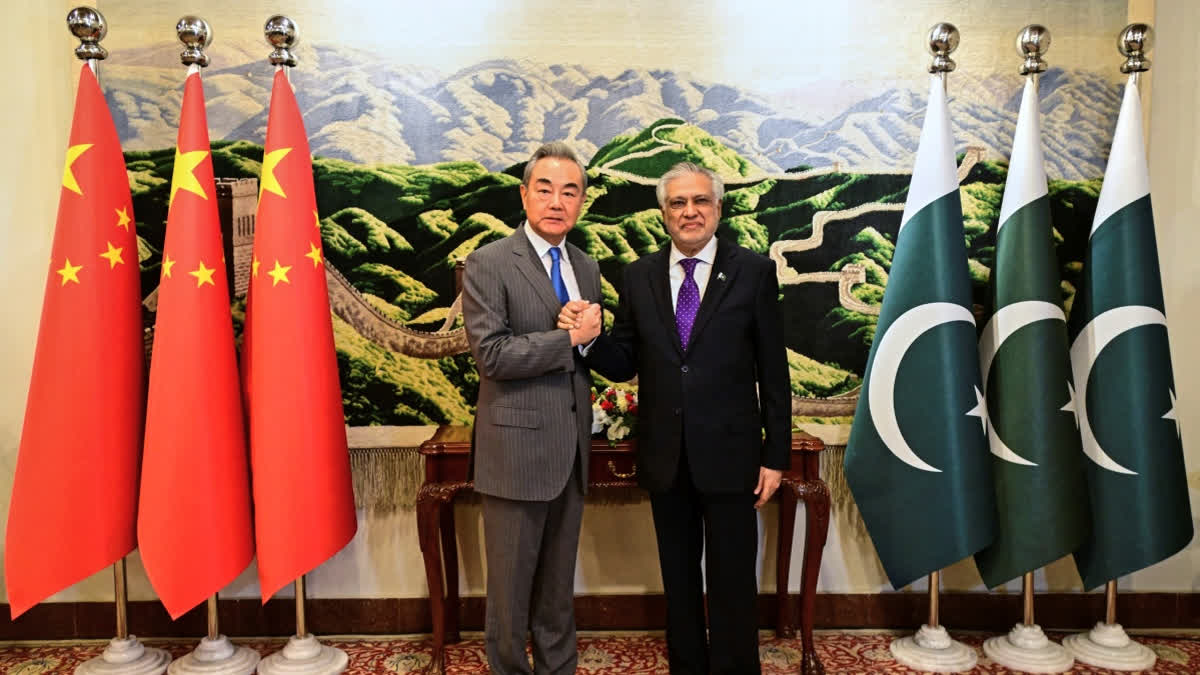 China's Foreign Minister Wang Meets Dar, Reviews Entire Gamut Of Bilateral Ties China's Foreign Minister Wang Meets Dar, Reviews Entire Gamut Of Bilateral Ties