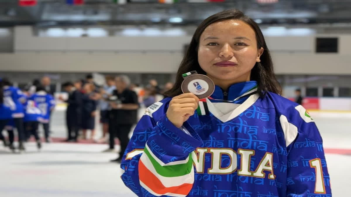 Rigzin Yangdol with the medal in Dubai.