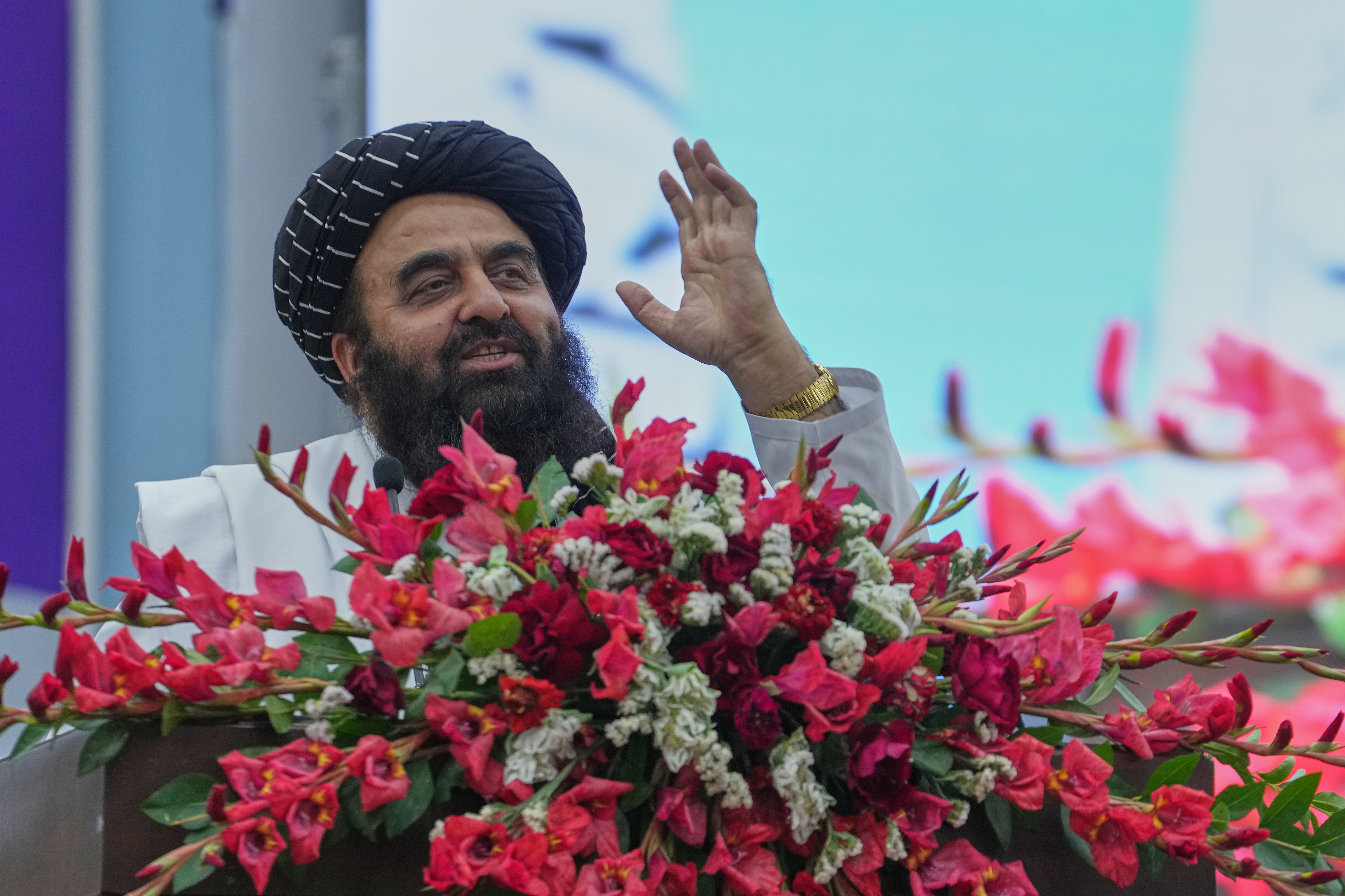 Afghan Foreign Minister Amir Khan Muttaqi talks to Taliban delegates from across the country as they gather for a meeting opening celebrations for the fifth anniversary of the U.S. withdrawal and the Taliban's return to power, at Loya Jirga Hall in Kabul, Afghanistan, Saturday, Aug. 15, 2026.