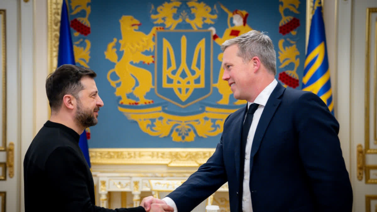 In this photo provided by the Ukrainian Presidential Press Office, Ukrainian President Volodymyr Zelenskyy, left, shakes hands with U.S. Secretary of the Army Dan Driscoll in Kyiv, Ukraine, Thursday, Nov. 20, 2025.