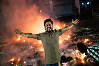 A protester reacts to the camera near the premises of the Prothom Alo daily newspaper which was set on fire by angry protesters after news reached the country from Singapore of the death of a prominent activist Sharif Osman Hadi, in Dhaka, Bangladesh, Friday, Dec. 19, 2025.