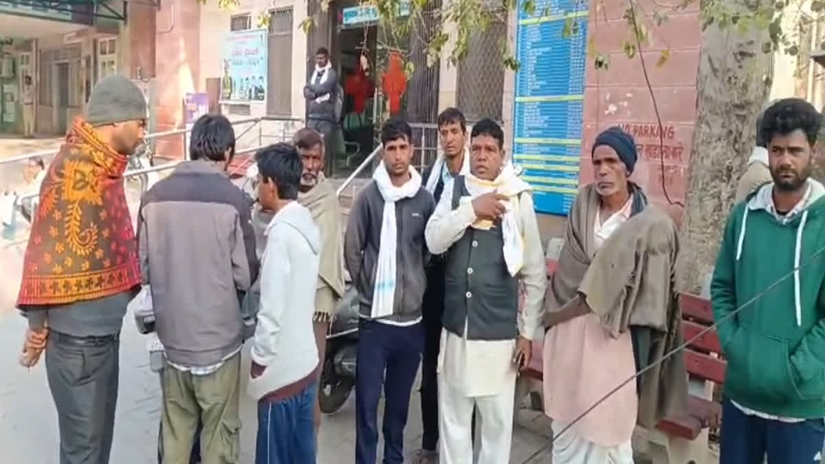 Relatives of the deceased outside the mortuary