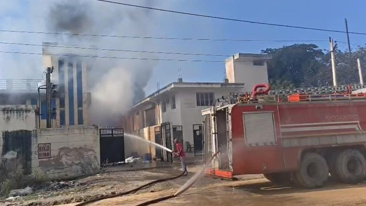 Firefighters extinguishing a factory fire