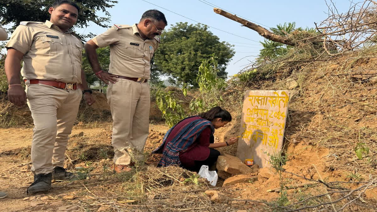 Government personnel carrying out the process of opening the road