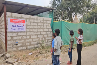 Children stop to read the notice