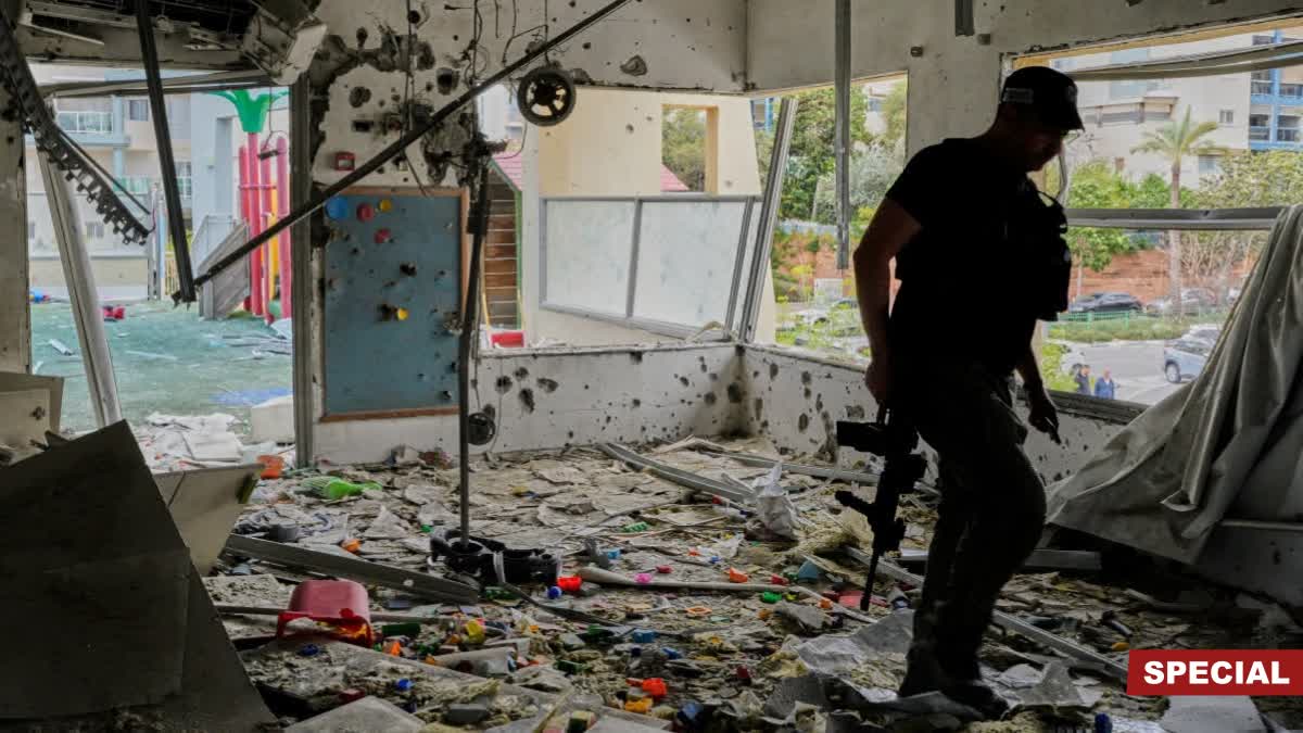 An Israeli policeman walks in a kindergarten hit by fragments of an Iranian missile in Rishon LeZion, Israel, Saturday, March 21, 2026.