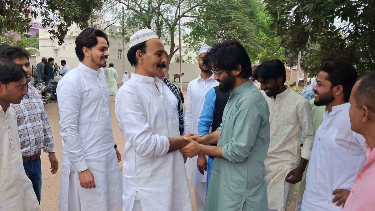Sharjeel Imam meets with a family member upon reching his anscestral village in Jehanabad.