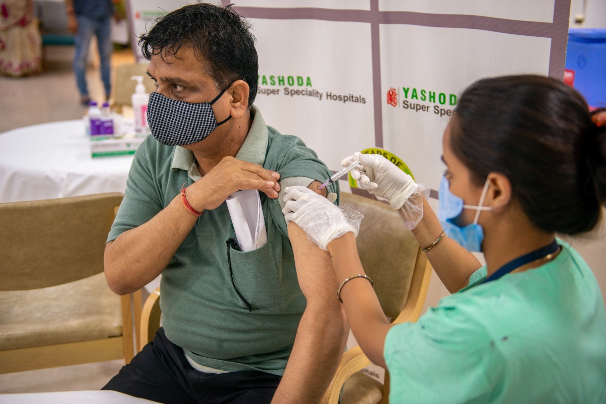 Middle aged man gets a vaccine