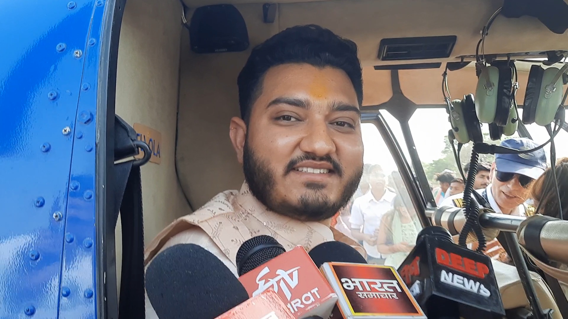 Groom Abhishek sits in a chopper alongside his bride in Jhansi, Uttar Pradesh