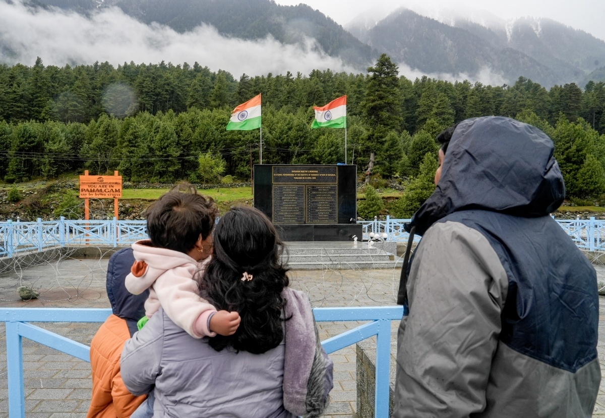 People pay homage at the Baisaran memorial in remembrance of the martyrs of Pahalgam terror attack.