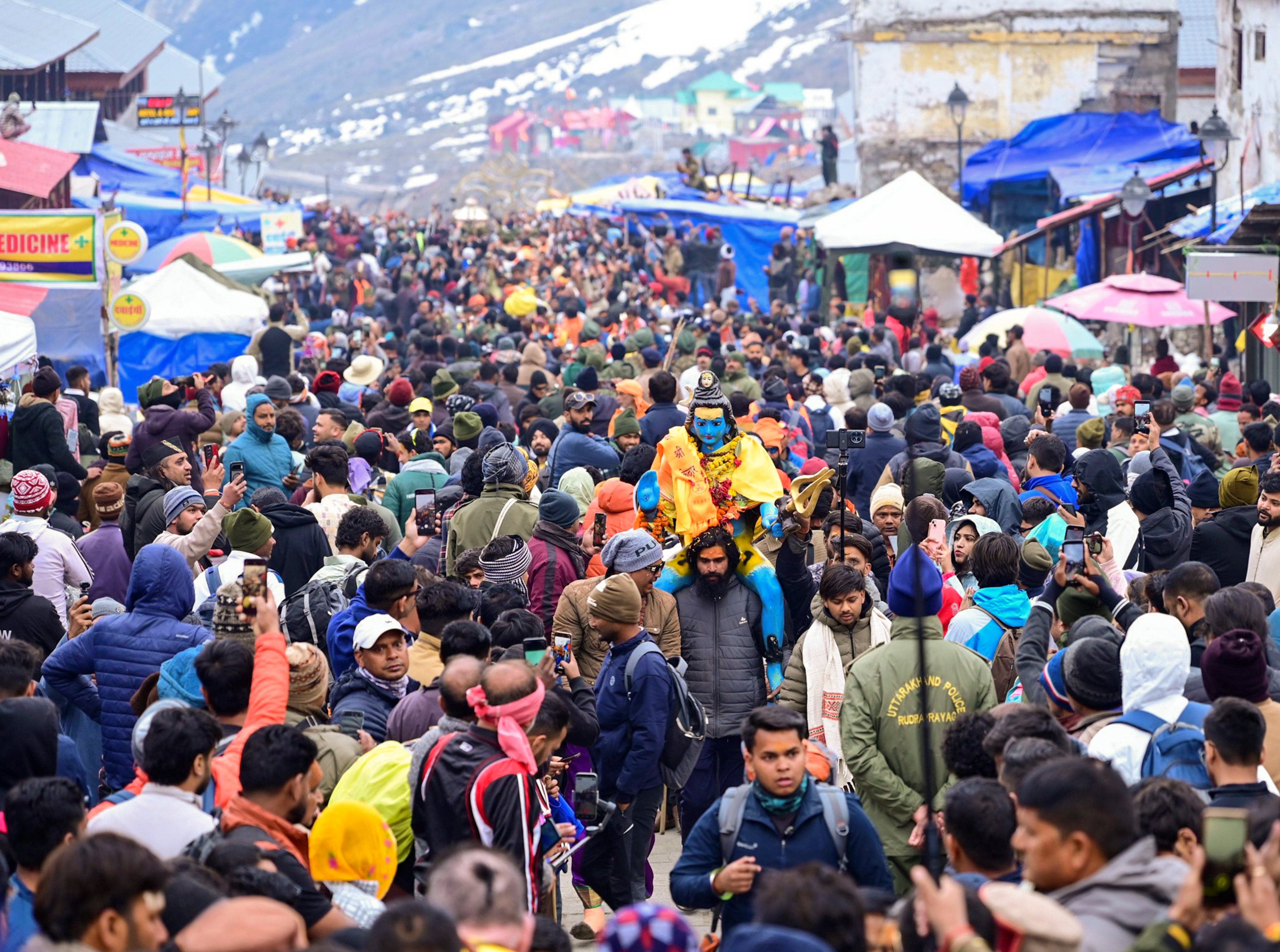 Pilgrims queue for darshan at Kedarnath Temple on the first day of the pilgrimage season.