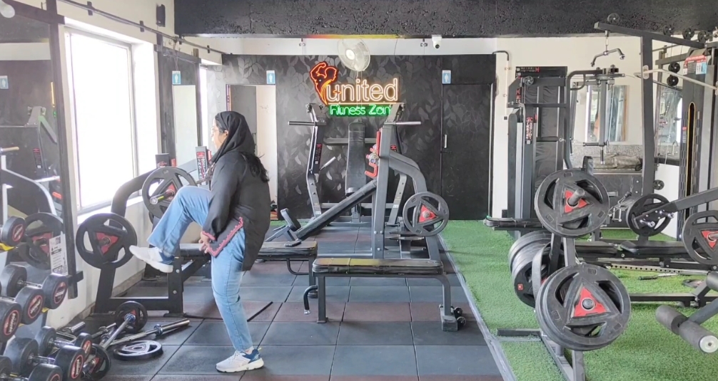 A woman works out at a gym in Srinagar