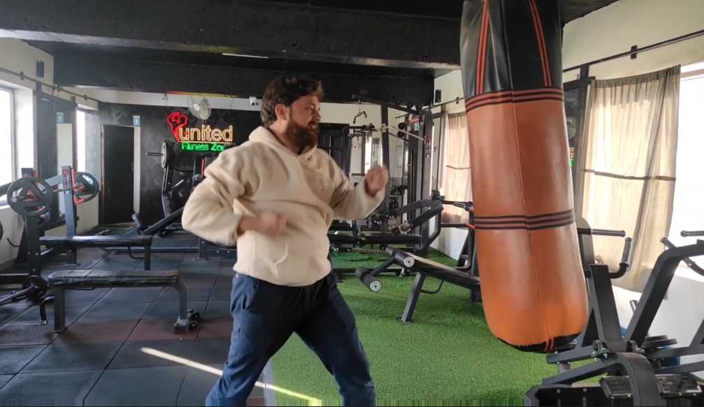A youth works out at a gym in Srinagar