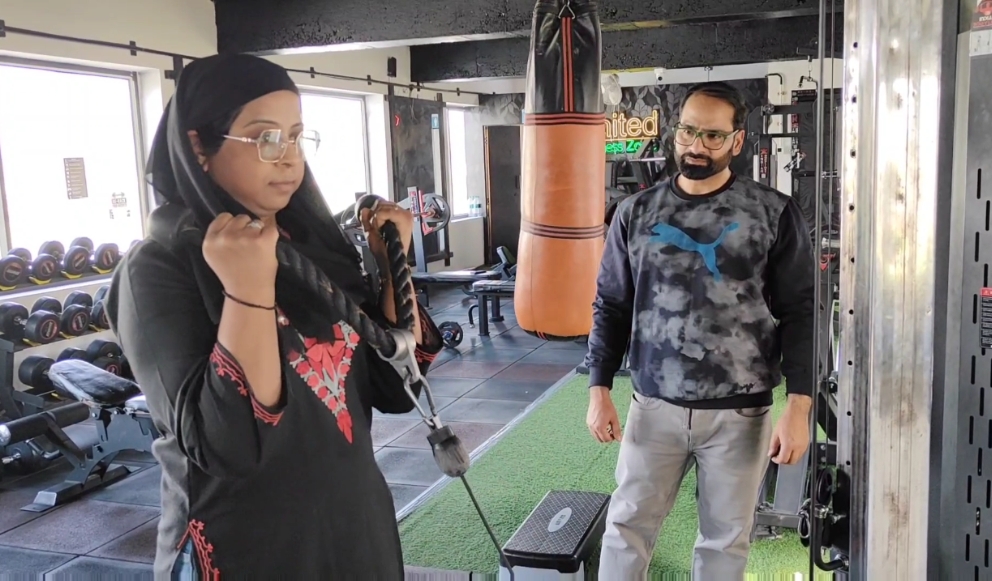 A woman works out at a gym in Srinagar