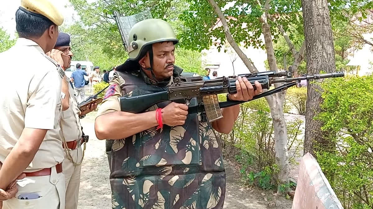 Security personnel confronting 'terrorists' during a mock drill