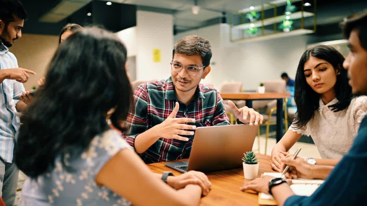 The Real Secret Of A Meaningful Career Is Not About 'Discovering Your Passion', But About Designing A Life Gen Z office workers in a meeting