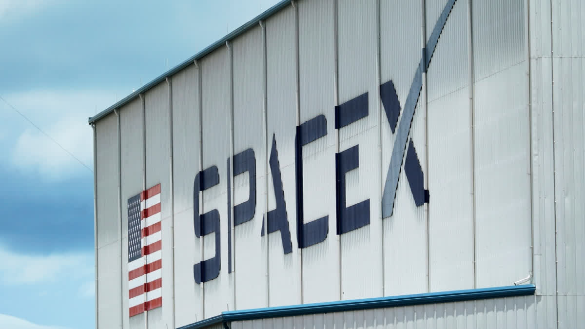 FILE - The SpaceX logo is displayed on a building, May 26, 2020, at the Kennedy Space Center in Cape Canaveral, Fla.