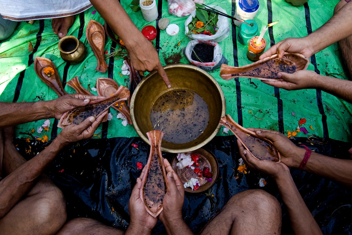 Teen devotees offering Tarpan