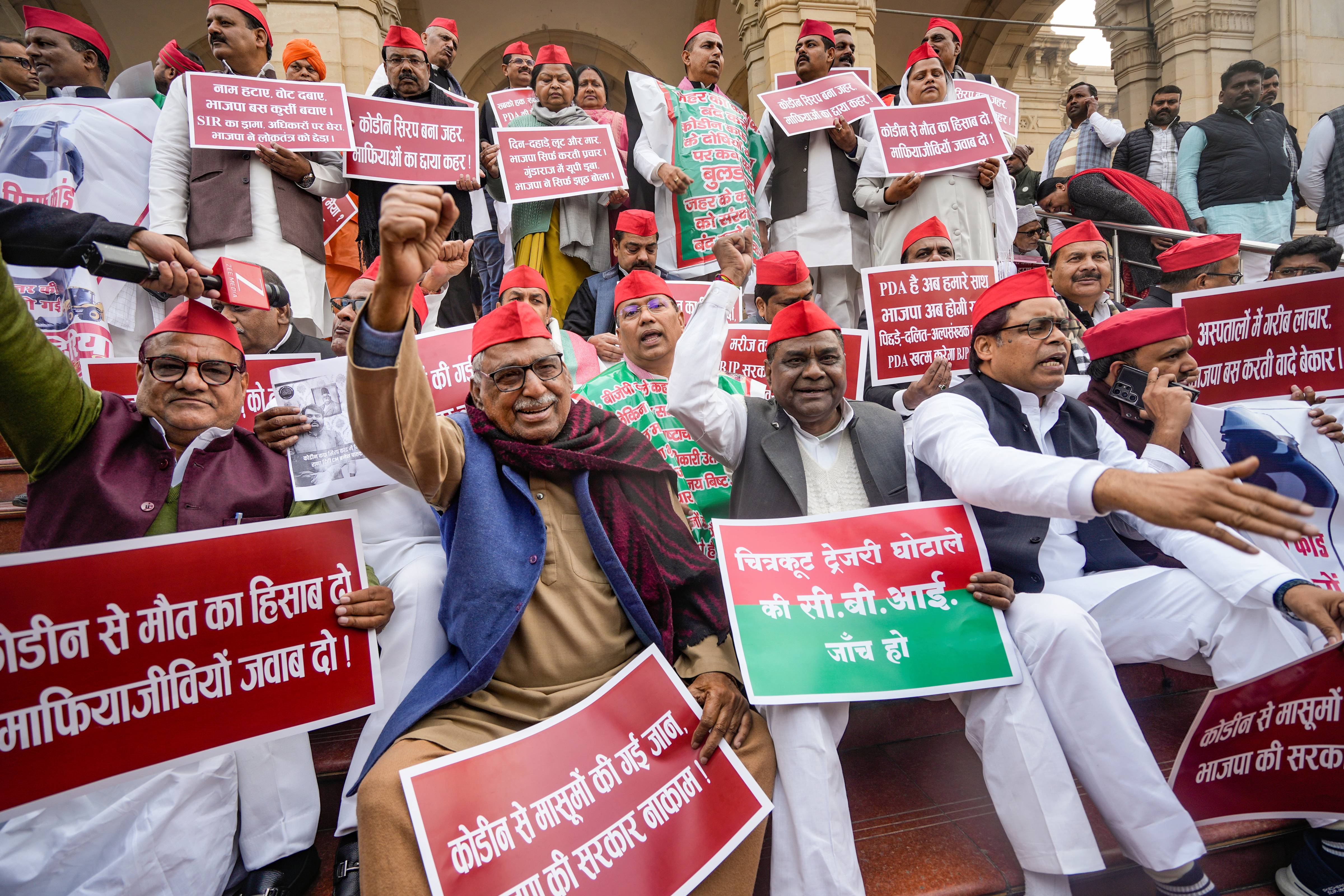 SP MLAs stage a protest outside the assembly over the cough syrup scam.