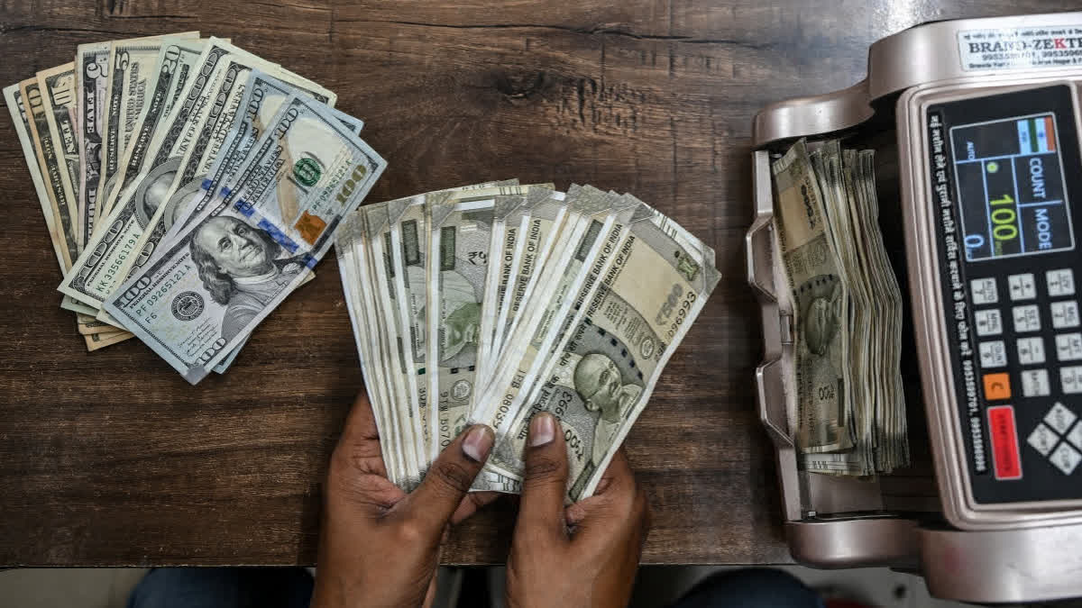 Rupee Slumps 50 Paise To Settle At Fresh Record Low Of 94.03 Against US Dollar A worker counts US dollar and Indian rupee currency notes poses for a photograph at a money exchange outlet in New Delhi on April 3, 2025.