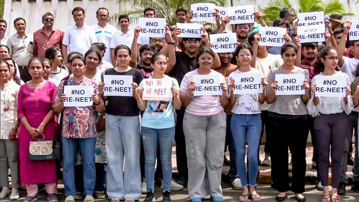 NEET, NET Row: Academics Urge Centre To Uphold Exam Integrity, Say Quick Fixes Won't Do Students hold placards as they stage a protest against the re-examination of the NEET-UG exams, in Rajkot on Sunday.
