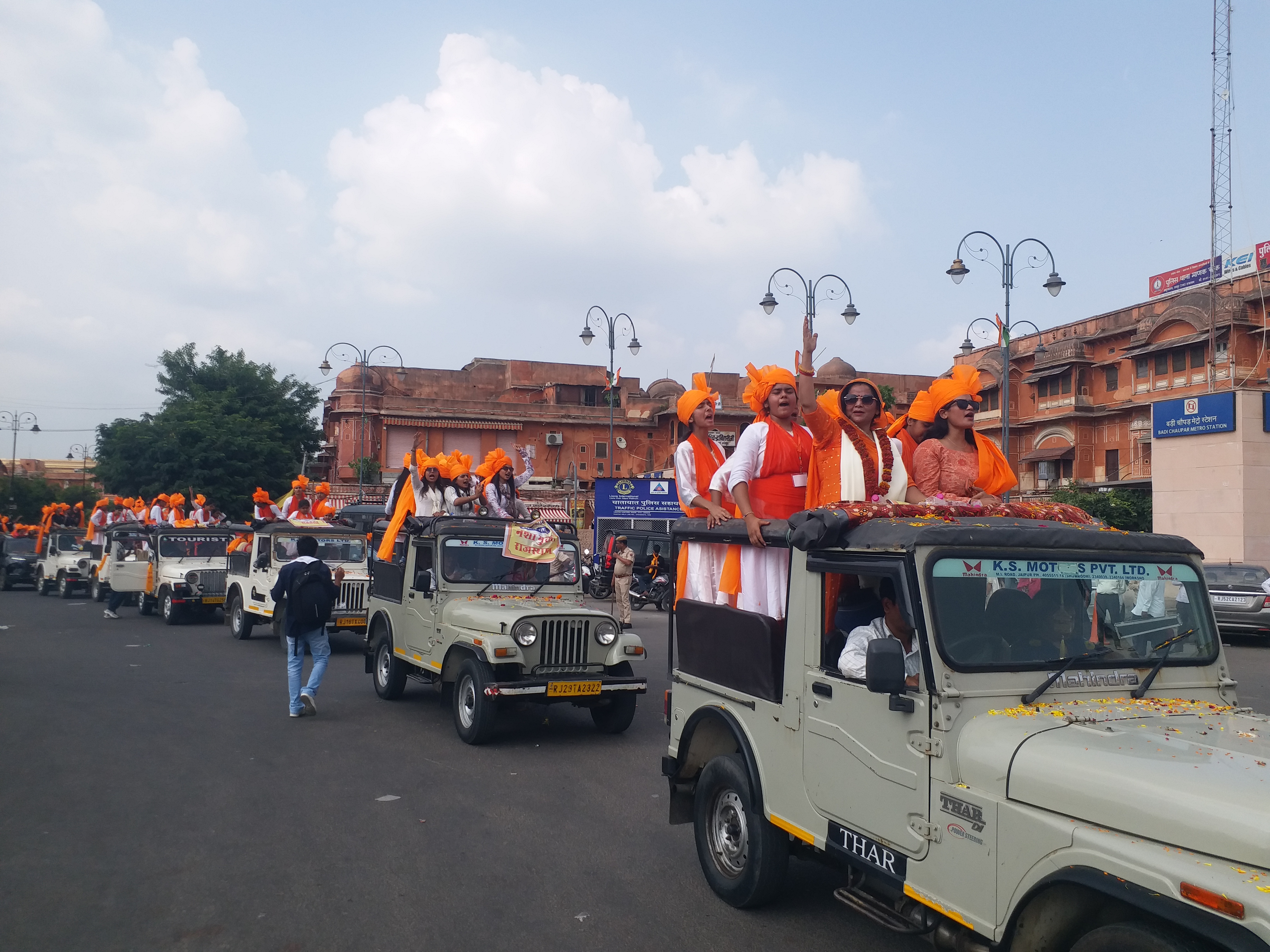 Youth in saffron and saffron scarves