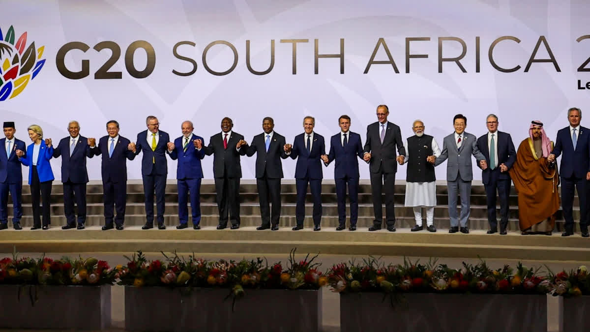 n this image released on Nov. 22, 2025, Prime Minister Narendra Modi with world leaders during a group photograph at the G20 Leaders' Summit, in Johannesburg, South Africa.