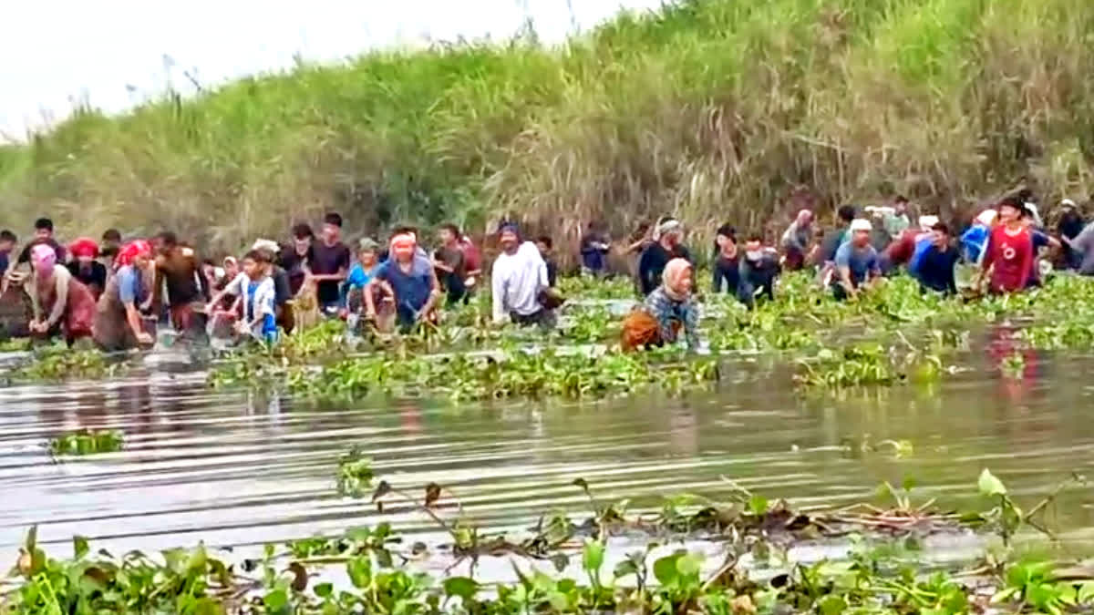 Traditional community fishing in Majuli