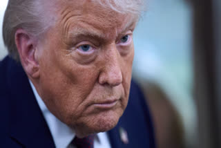 President Donald Trump speaks with reporters aboard Air Force One after leaving the World Economic Forum in Davos for Washington, Thursday, Jan. 22, 2026.