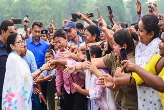 Chief Minister Mamata Banerjee greets supporters during a public rally in Jalpaiguri on Tuesday.