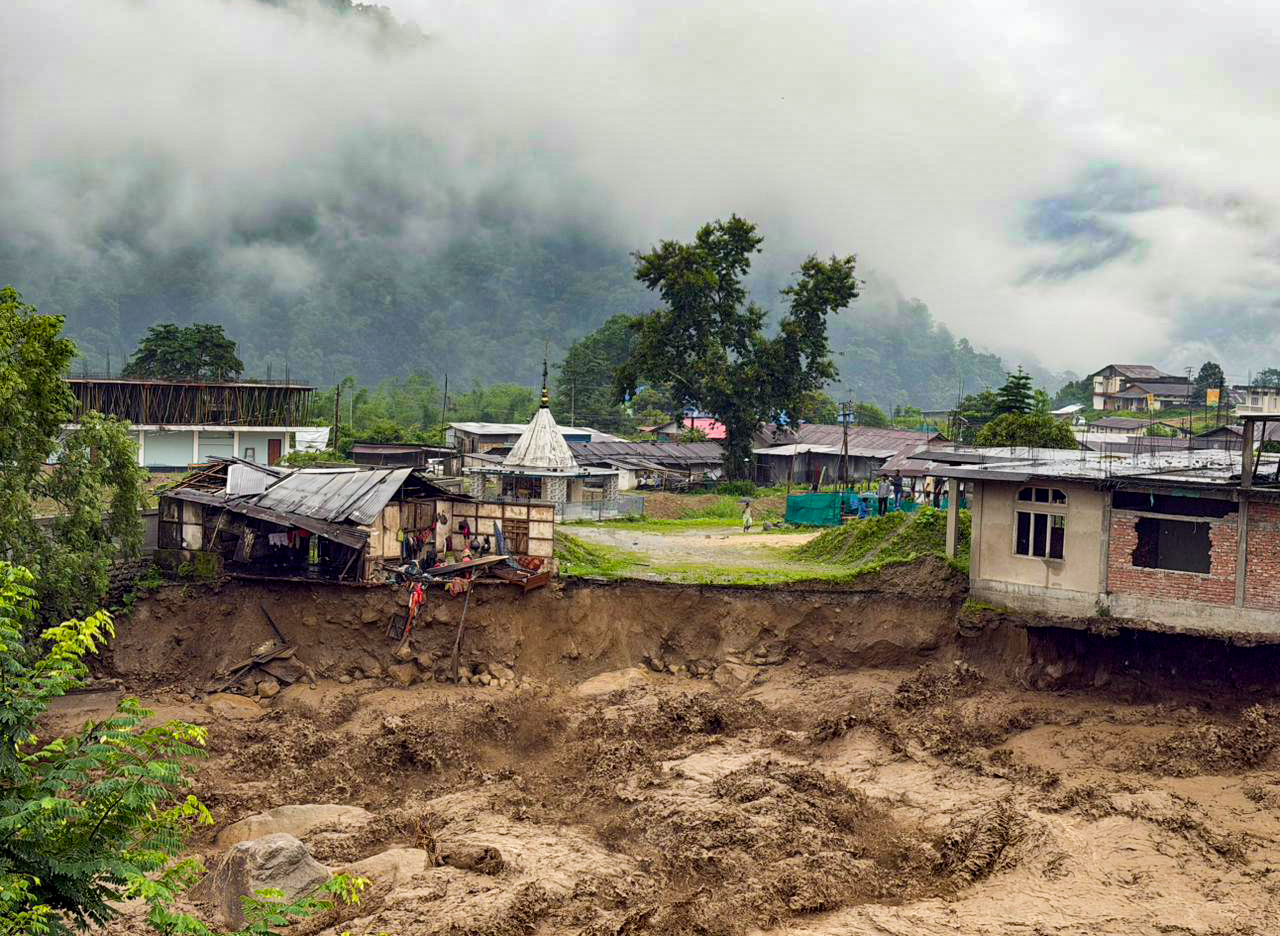 A view of houses damaged by flash floods and landslides in Keyi Panyor district of Arunachal Pradesh on Wednesday.