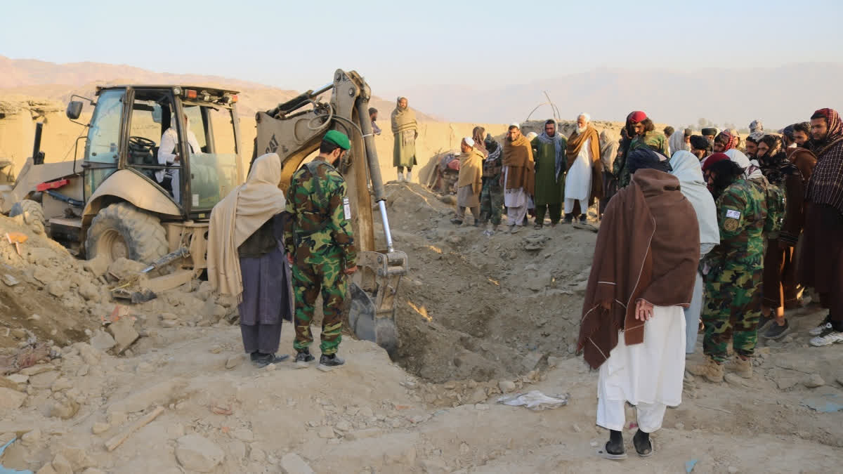 A bulldozer clears the rubble of a house hit by a cross-border Pakistani army strike in the Behsud district of Nangarhar province, Afghanistan, Sunday, Feb. 22, 2026.