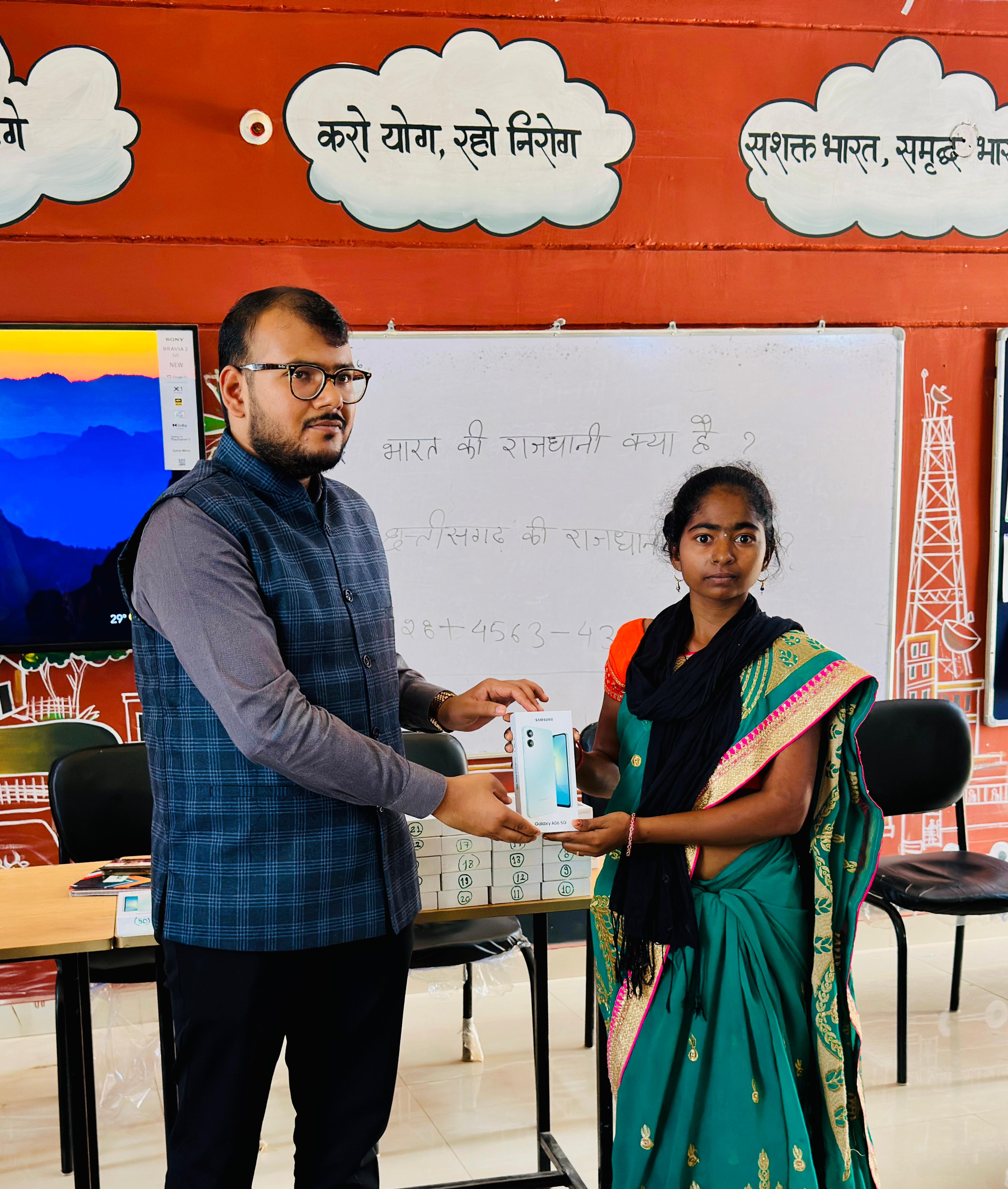 Distribution of mobile phones to surrendered Naxalites