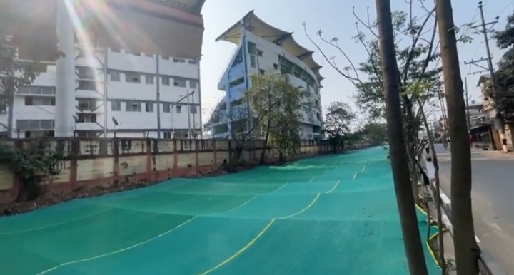 Beneath the green cover is a dead stinking river