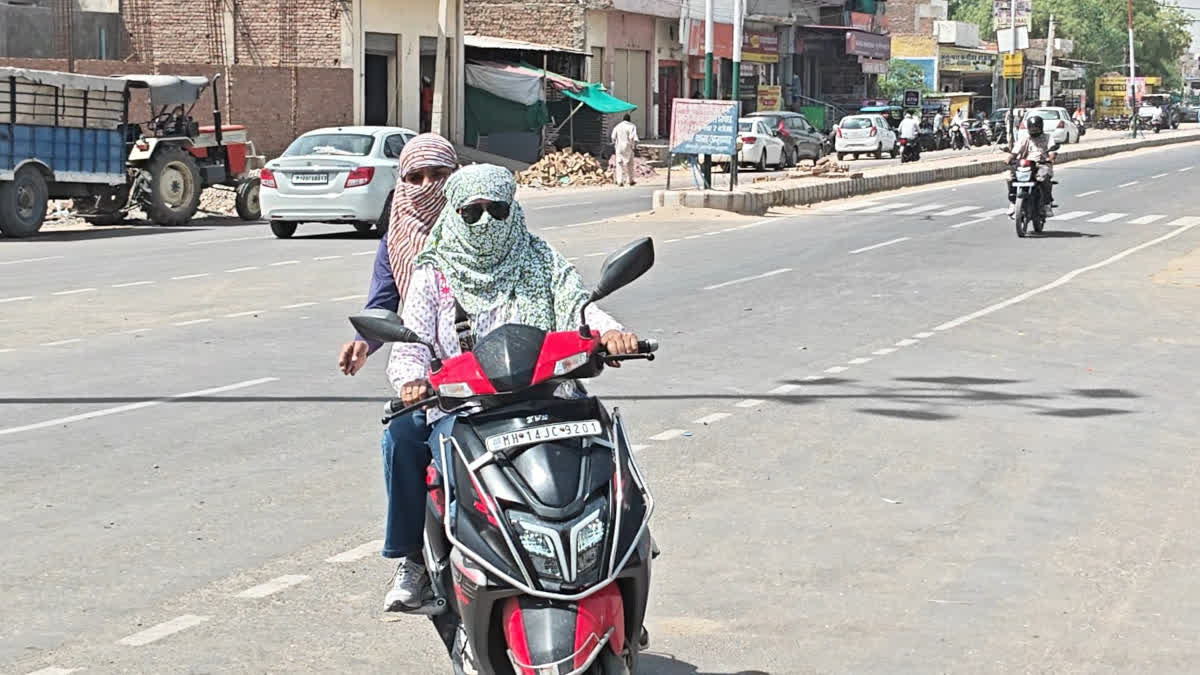Girls driving with their faces covered during summer