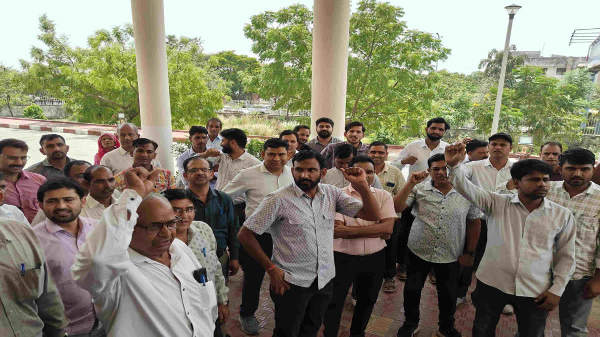 Employees staging a protest at the Aranya Bhawan complex in Jhalana.